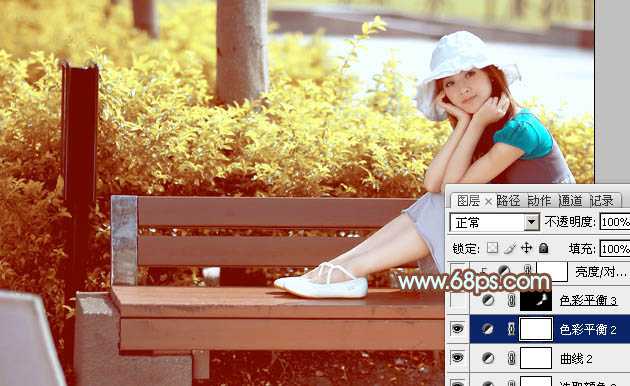 ‘Photoshop为坐在公园椅子上的美女图片增加流行的韩系黄褐色‘
