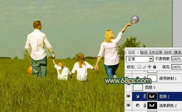 ‘Photoshop下将草地人物图片调成柔美的暗调橙红色‘