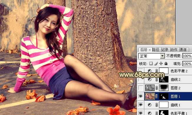 ‘Photoshop为坐路面上的人物图片调制出颓废的暖色调‘