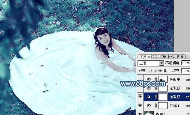 ‘Photoshop将草地婚纱美女调制出流行的青蓝色‘