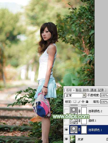 ‘Photoshop将树边美女图片调制出唯美的淡调嫩绿色‘
