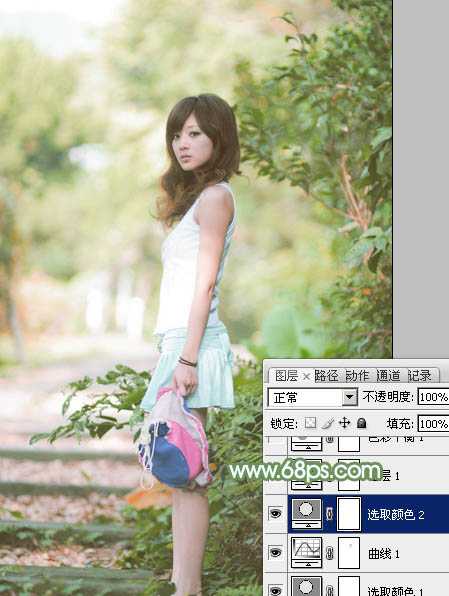 ‘Photoshop将树边美女图片调制出唯美的淡调嫩绿色‘