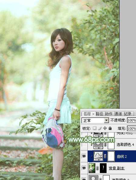 ‘Photoshop将树边美女图片调制出唯美的淡调嫩绿色‘