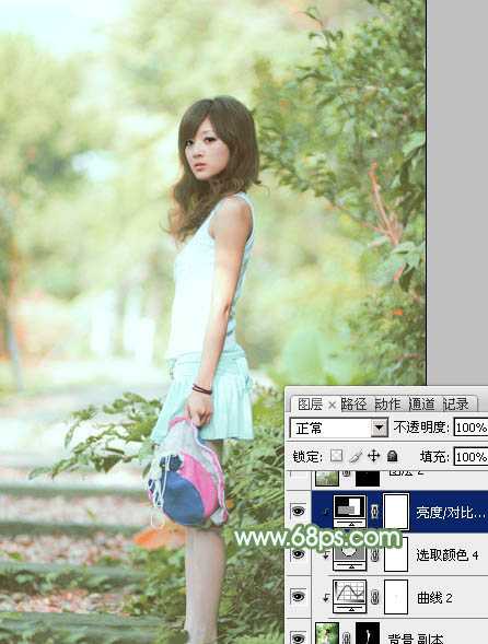 ‘Photoshop将树边美女图片调制出唯美的淡调嫩绿色‘