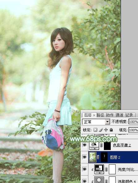 ‘Photoshop将树边美女图片调制出唯美的淡调嫩绿色‘