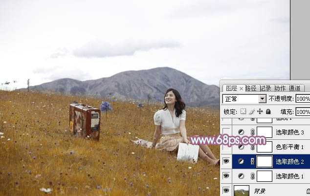 ‘Photoshop将草地美女增加上淡淡的蓝红色‘