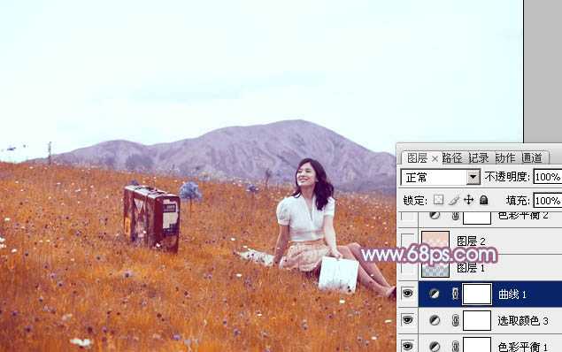 ‘Photoshop将草地美女增加上淡淡的蓝红色‘