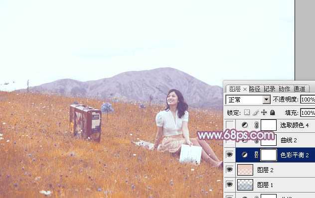 ‘Photoshop将草地美女增加上淡淡的蓝红色‘