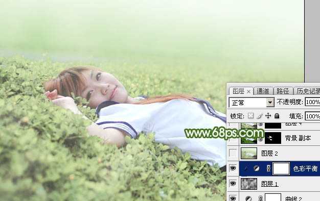 ‘Photoshop将草地上的美女图片增加唯美的春季粉绿色‘