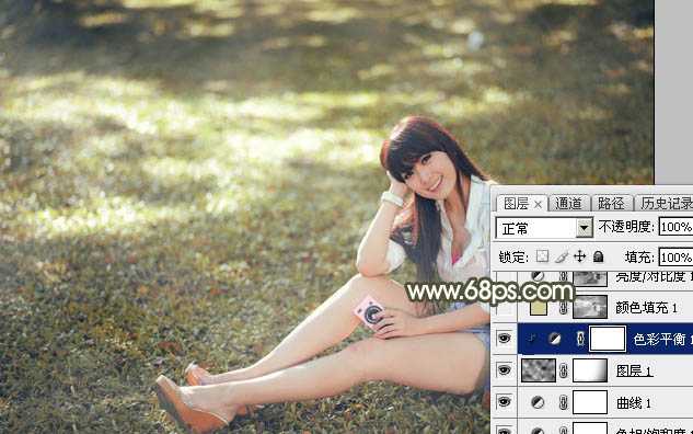 ‘Photoshop将草地美女图片打造出唯美的阳光褐色‘