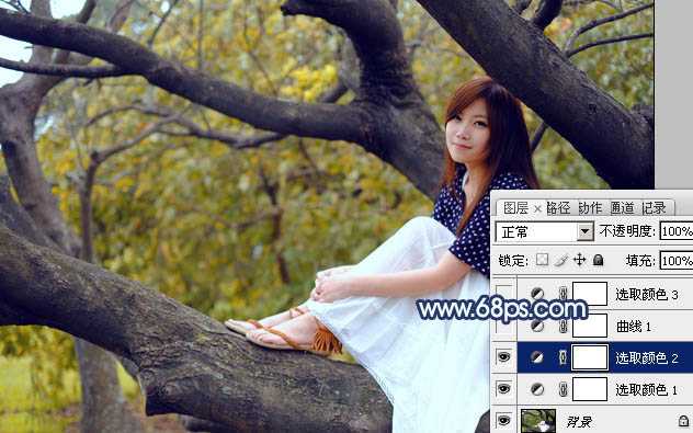 ‘Photoshop为坐树枝上的美女调制出小清新的蓝黄色‘