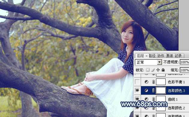 ‘Photoshop为坐树枝上的美女调制出小清新的蓝黄色‘