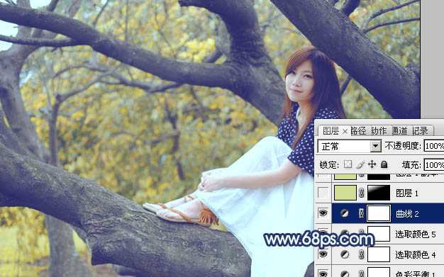 ‘Photoshop为坐树枝上的美女调制出小清新的蓝黄色‘