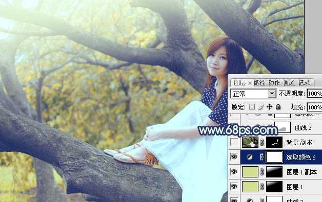 ‘Photoshop为坐树枝上的美女调制出小清新的蓝黄色‘