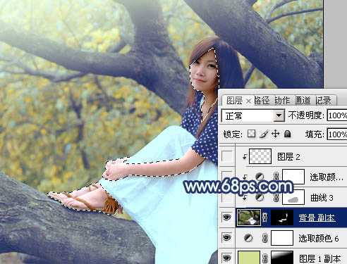 ‘Photoshop为坐树枝上的美女调制出小清新的蓝黄色‘