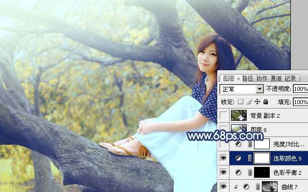 ‘Photoshop为坐树枝上的美女调制出小清新的蓝黄色‘