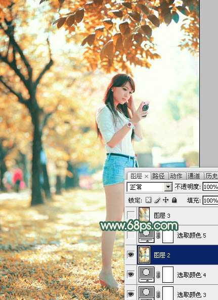 ‘Photoshop将树边美女调出甜美的秋季橙红色‘