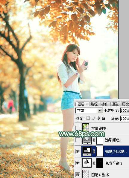 ‘Photoshop将树边美女调出甜美的秋季橙红色‘
