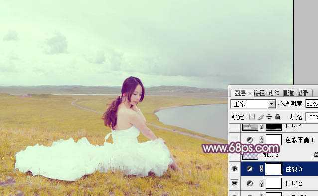 ‘Photoshop将草原人物图片调制出小清新的黄蓝色‘