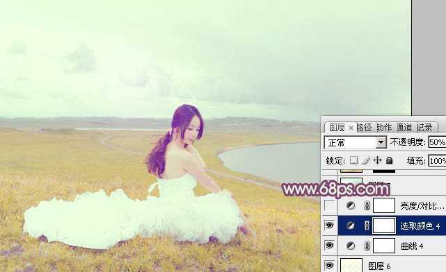 ‘Photoshop将草原人物图片调制出小清新的黄蓝色‘