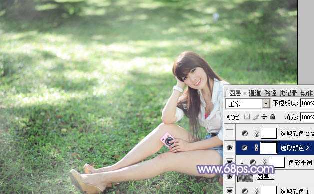 ‘Photoshop为绿草中的美女加上梦幻的青蓝色‘