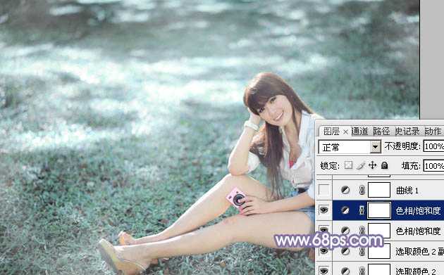 ‘Photoshop为绿草中的美女加上梦幻的青蓝色‘