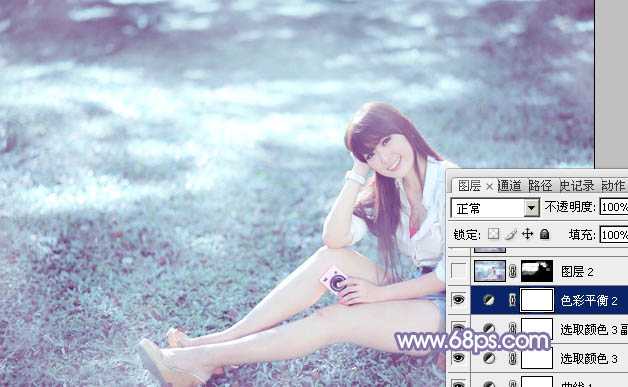‘Photoshop为绿草中的美女加上梦幻的青蓝色‘