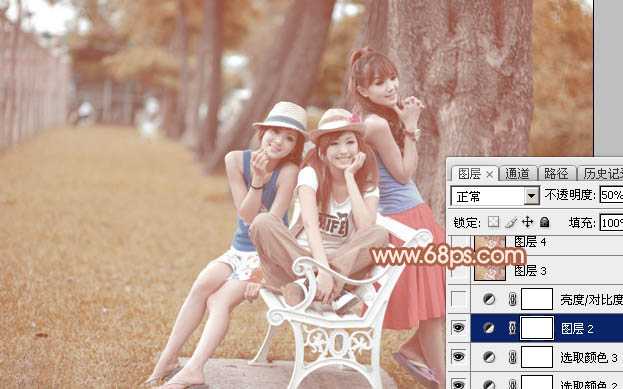 ‘Photoshop为树边的美女加上柔美的中性淡红色‘