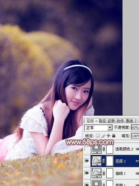 ‘Photoshop将草地上的美女调制出柔美的橙紫色‘