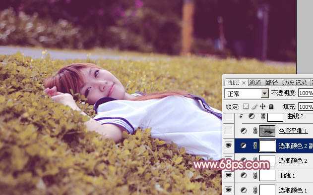 ‘Photoshop将躺草地上的美女打造出柔和的秋季红褐色‘