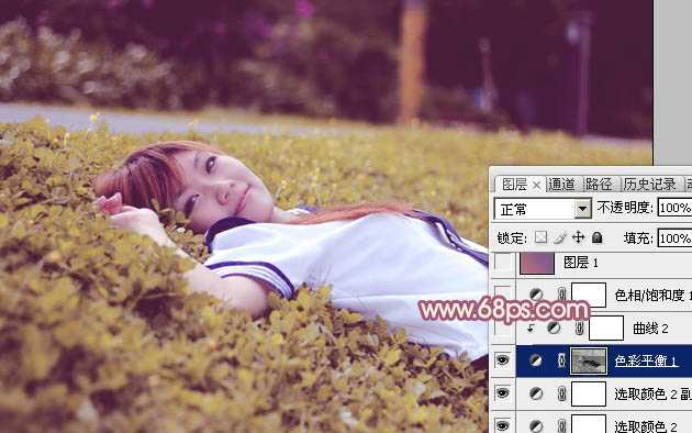 ‘Photoshop将躺草地上的美女打造出柔和的秋季红褐色‘