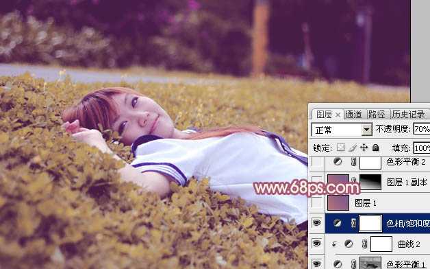 ‘Photoshop将躺草地上的美女打造出柔和的秋季红褐色‘